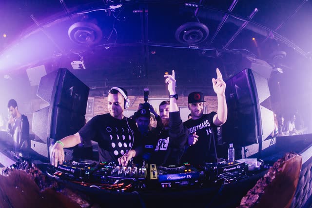 Three artists in the booth during a Night Bass show
